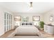 Cozy bedroom with neutral decor, ceiling fan, and a closet with mirrored doors at 103 Colonel Richard Rankin Dr, Stanley, NC 28164