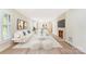 Bright living room with plantation shutters, modern decor, fireplace, and wood flooring at 103 Colonel Richard Rankin Dr, Stanley, NC 28164