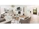Open concept living room with fireplace, modern furniture, and view of the kitchen at 103 Colonel Richard Rankin Dr, Stanley, NC 28164