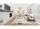 Spacious living room featuring a brick fireplace, modern furniture, and a patterned area rug at 103 Colonel Richard Rankin Dr, Stanley, NC 28164