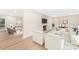 Open concept living room with fireplace, modern furniture, and connected dining room at 103 Colonel Richard Rankin Dr, Stanley, NC 28164