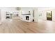 Open living room with fireplace, bright neutral colors, and open concept floor plan at 103 Colonel Richard Rankin Dr, Stanley, NC 28164