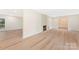 Spacious living room with hardwood floors, fireplace, and an open floor plan at 103 Colonel Richard Rankin Dr, Stanley, NC 28164