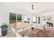 Inviting sunroom with brick flooring and comfortable seating at 103 Colonel Richard Rankin Dr, Stanley, NC 28164