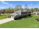 Stately two-story brick home with well-manicured lawn and attached two car garage at 1052 Perth Rd, Troutman, NC 28166