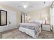Comfortable bedroom with ceiling fan, carpeted floor, and closet storage at 1052 Perth Rd, Troutman, NC 28166