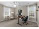 Bedroom with windows, ceiling fan, and desk setup, perfect for an office at 1052 Perth Rd, Troutman, NC 28166