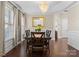 Traditional dining room features wood floors, a large dining table, and elegant decor at 1052 Perth Rd, Troutman, NC 28166