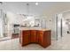 Kitchen with wooden cabinets and granite countertops that opens up to the living room at 1052 Perth Rd, Troutman, NC 28166