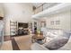 Bright living room boasts a soaring ceiling and wood floors at 1052 Perth Rd, Troutman, NC 28166