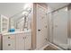 Clean bathroom with tiled floor, walk-in shower, and vanity at 10609 Oak Pond Cir, Charlotte, NC 28277