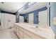 Spacious bathroom featuring double vanity and large mirror at 10609 Oak Pond Cir, Charlotte, NC 28277