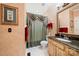 Bathroom with unique textured walls, a decorative mirror, and ornate accents at 10609 Oak Pond Cir, Charlotte, NC 28277