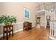 Inviting hallway with hardwood floors leading to the dining room and staircase at 10609 Oak Pond Cir, Charlotte, NC 28277