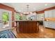 Spacious kitchen featuring a large island, stainless steel appliances, and ample counter space at 10609 Oak Pond Cir, Charlotte, NC 28277