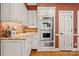 Kitchen cabinets with stainless steel oven, microwave, and granite countertops at 10609 Oak Pond Cir, Charlotte, NC 28277