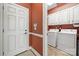 Functional laundry room with ample cabinet space and modern appliances, providing convenience at 10609 Oak Pond Cir, Charlotte, NC 28277