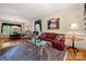 Cozy living room featuring classic furnishings, a patterned rug, and ample natural light at 10609 Oak Pond Cir, Charlotte, NC 28277