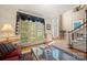 Bright and airy living room with large windows, hardwood floors, and stylish decor at 10609 Oak Pond Cir, Charlotte, NC 28277