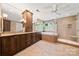 Luxurious bathroom with dual sinks, a soaking tub, and tiled walk-in shower at 10609 Oak Pond Cir, Charlotte, NC 28277
