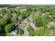 Aerial view of home in a neighborhood surrounded by mature trees and lush greenery at 1068 14Th Nw Ave, Hickory, NC 28601