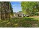 View of the house from the backyard featuring a spacious yard and a car parked in the driveway at 1068 14Th Nw Ave, Hickory, NC 28601