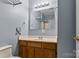 Simple bathroom with a wooden vanity, a mirror, and a shower with a curtain at 1068 14Th Nw Ave, Hickory, NC 28601