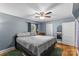 Neutral bedroom with a ceiling fan, window with natural light, and a door to the left side at 1068 14Th Nw Ave, Hickory, NC 28601