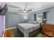 Neutral bedroom with a ceiling fan, window with curtains, and a dresser to the right side at 1068 14Th Nw Ave, Hickory, NC 28601