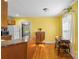 Well-lit kitchen featuring wooden cabinets and a dining area by the window at 1068 14Th Nw Ave, Hickory, NC 28601