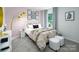 Cozy bedroom with bright pink walls, natural lighting, contemporary decor, and carpeted floors at 121 Falling Up Ln, Salisbury, NC 28147
