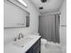 Bathroom featuring a blue vanity with a stylish mirror and a shower with modern fixtures at 1277 Rainbow Cir, Catawba, SC 29704