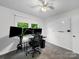 Multi-monitor setup in a bright bedroom, perfect for a home office or gaming setup, with ceiling fan at 1277 Rainbow Cir, Catawba, SC 29704