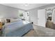 Comfortable bedroom features soft carpet, natural light from two windows, and minimalist decor at 1277 Rainbow Cir, Catawba, SC 29704