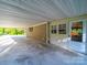 Covered carport featuring an attached storage room, offering ample parking and storage at 1277 Rainbow Cir, Catawba, SC 29704