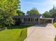 Charming brick home with a well-manicured lawn and convenient carport at 1277 Rainbow Cir, Catawba, SC 29704
