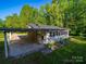 Charming home surrounded by lush trees and offering an attached covered carport at 1277 Rainbow Cir, Catawba, SC 29704