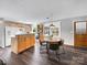 Bright kitchen and dining area with white appliances, wood cabinets, island seating, and natural light at 1277 Rainbow Cir, Catawba, SC 29704