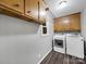 This laundry room includes cabinetry and modern white washer and dryer appliances at 1277 Rainbow Cir, Catawba, SC 29704
