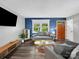 Cozy living room with a large window, modern furniture, and stylish decor on hardwood floors at 1277 Rainbow Cir, Catawba, SC 29704