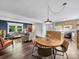 Open-concept living area with hardwood floors, a dining area, and a modern kitchen in view at 1277 Rainbow Cir, Catawba, SC 29704
