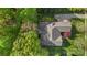 Aerial view of the home showcasing the mature trees, lawn and location on a quiet street at 1317 Waynewood Dr, Waxhaw, NC 28173