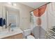 Bright bathroom featuring a vanity, toilet, and shower with an updated shower curtain at 1317 Waynewood Dr, Waxhaw, NC 28173