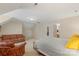 This bonus room boasts generous space, a sitting area, and a large bed at 1317 Waynewood Dr, Waxhaw, NC 28173