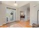 Bright foyer featuring hardwood floors, a decorative front door, and a view into other rooms of the home at 1317 Waynewood Dr, Waxhaw, NC 28173
