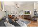 Bright and airy living room featuring a fireplace, hardwood floors, and an open layout into the dining area at 1317 Waynewood Dr, Waxhaw, NC 28173