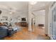 Spacious living room featuring hardwood floors, a fireplace, and an open floor plan leading into the dining area at 1317 Waynewood Dr, Waxhaw, NC 28173