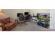 Home office with floral chair, workspace, natural light and gaming console at 1317 Waynewood Dr, Waxhaw, NC 28173