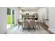 Dining area with a table, chairs, and sliding glass doors leading to the backyard, with a partial view to the kitchen at 133 Falling Up Ln, Salisbury, NC 28147