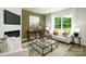 Living room features cozy fireplace, a large window, modern furniture, and stylish decor at 133 Falling Up Ln, Salisbury, NC 28147